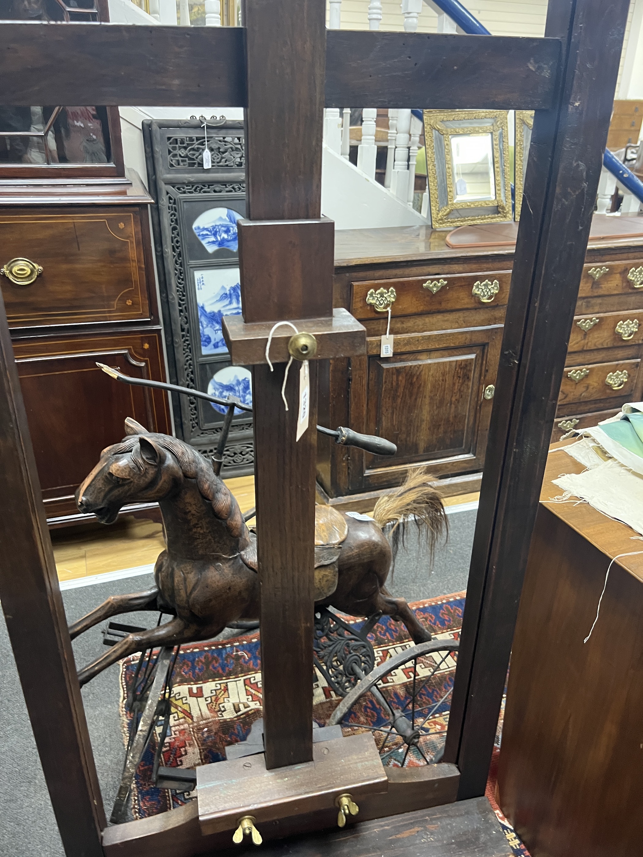 A late Victorian pine and beech artist's studio easel, width 62cm, height 180cm